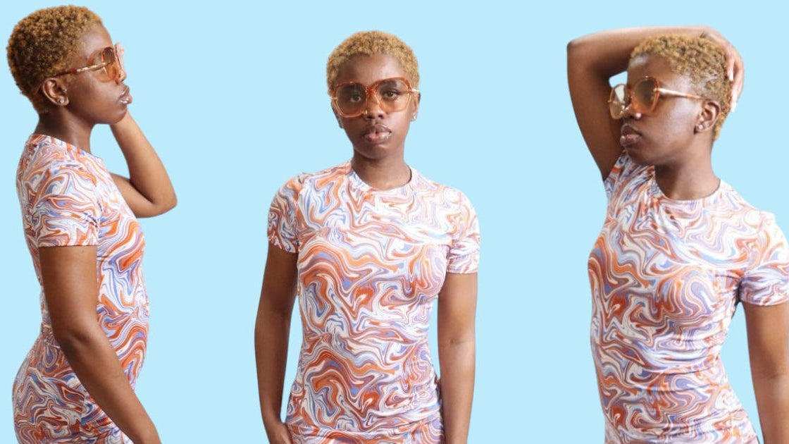 3  pictures of female model standing with blue, orange and white swirl design dressing posing in different positions. first image model is standing facing the right with one hand by her eye and othe hand at her side, second image model is facing forward with hands by her side, third image model is standing facing the left with hand on top of head and other hand at her side. background color is a light blue.